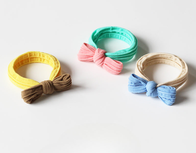 Adorable bow-tie hair tie for women, a popular net-famous hair accessory with a simple style.